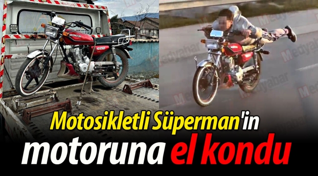 Motosikletli Süperman'in motoruna el kondu